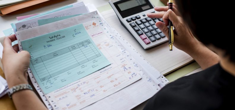 Asian woman working through paperwork